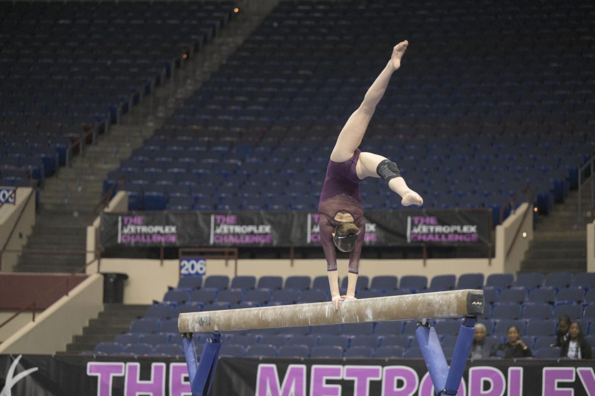 Anne flips across the beam at The Metroplex Challenge meet in February 2024 in Fort Worth, Texas.