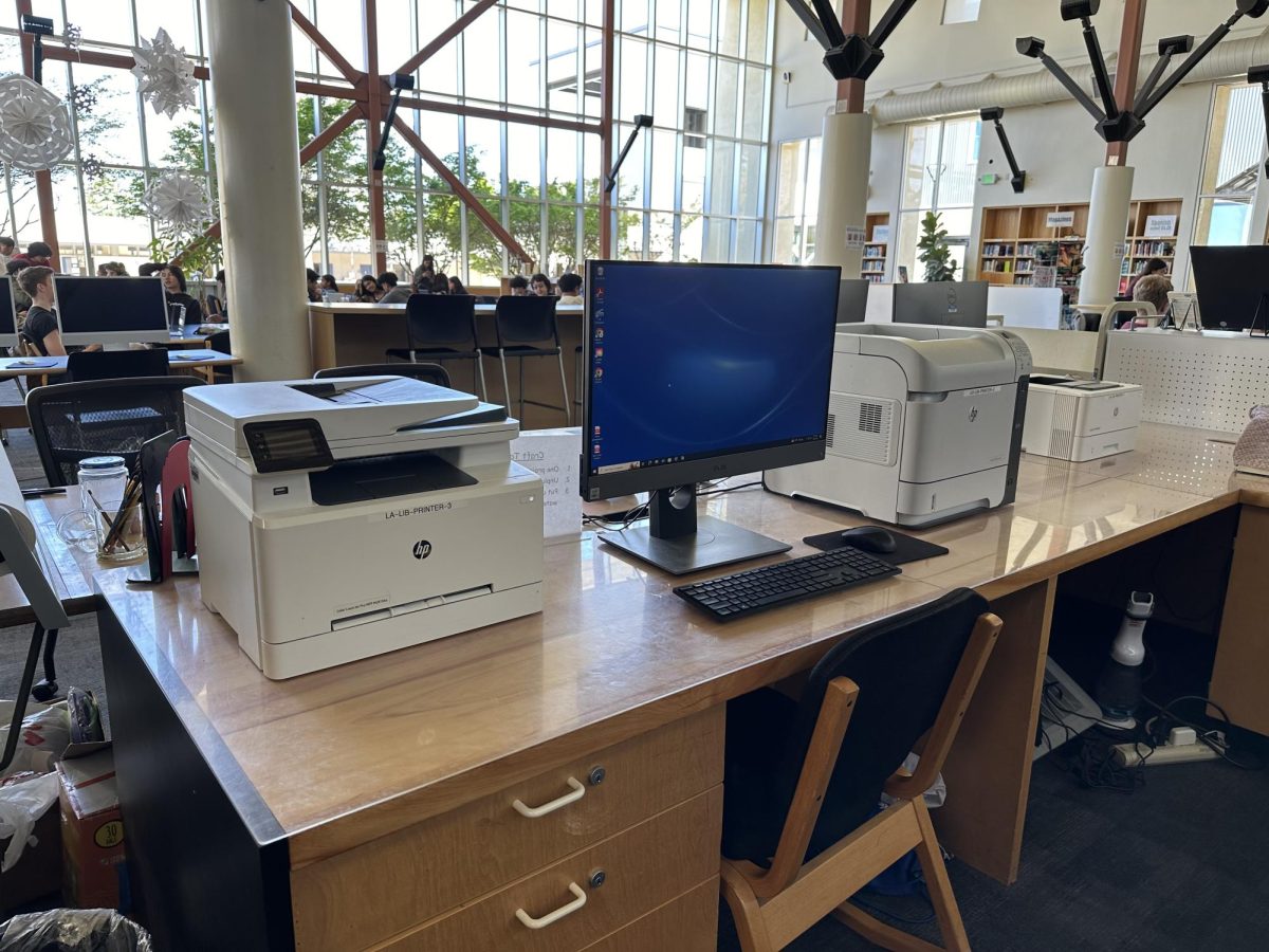 The black-and-white printer and the color printer sit in the Los Altos High School library, now free of charge.