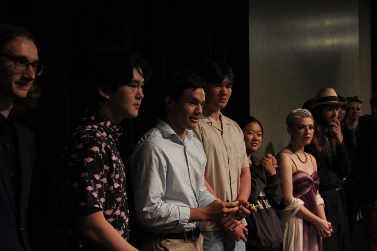 Members of The Video return to their spots on stage after accepting their second place award.