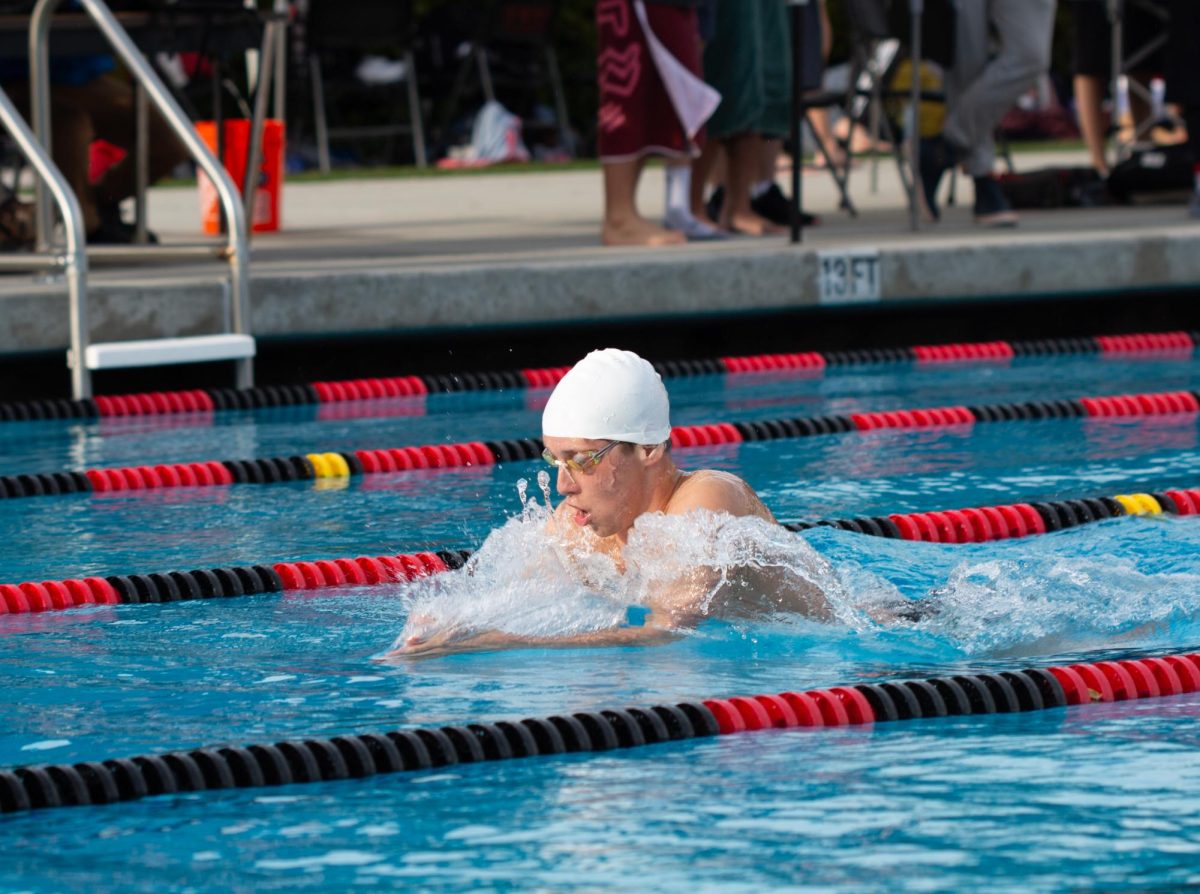Henry+swims+breaststroke+at+a+dual+meet+against+Gunn+High+School.