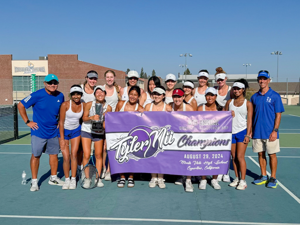 The girls varsity tennis team poses after winning the 5th annual Tyler Nii Memorial Champions Cup.