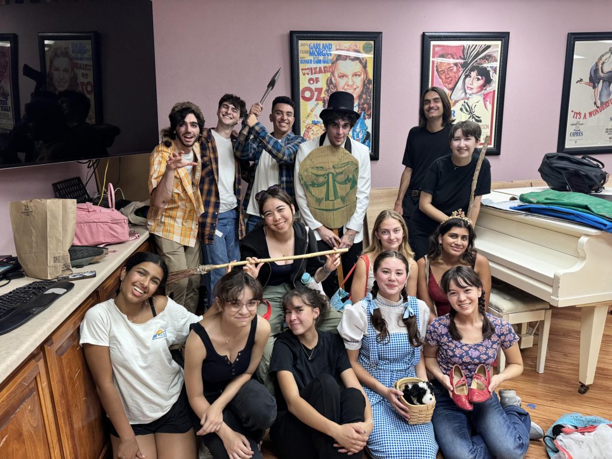 Wizard of Oz cast poses for a group photo after a show at the Sunshine Villa living facility in Santa Cruz.