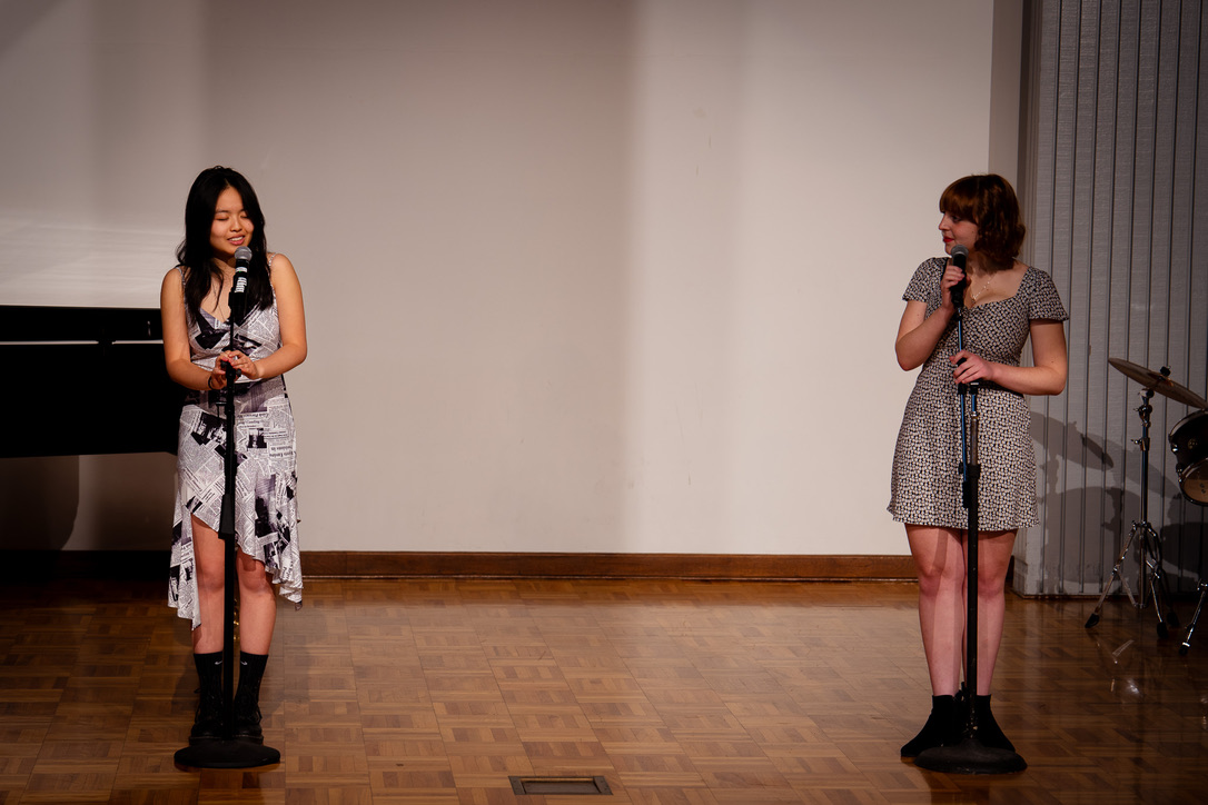 Senior Julia Fung and Rose Madsen ’24 perform at a fundraising concert.