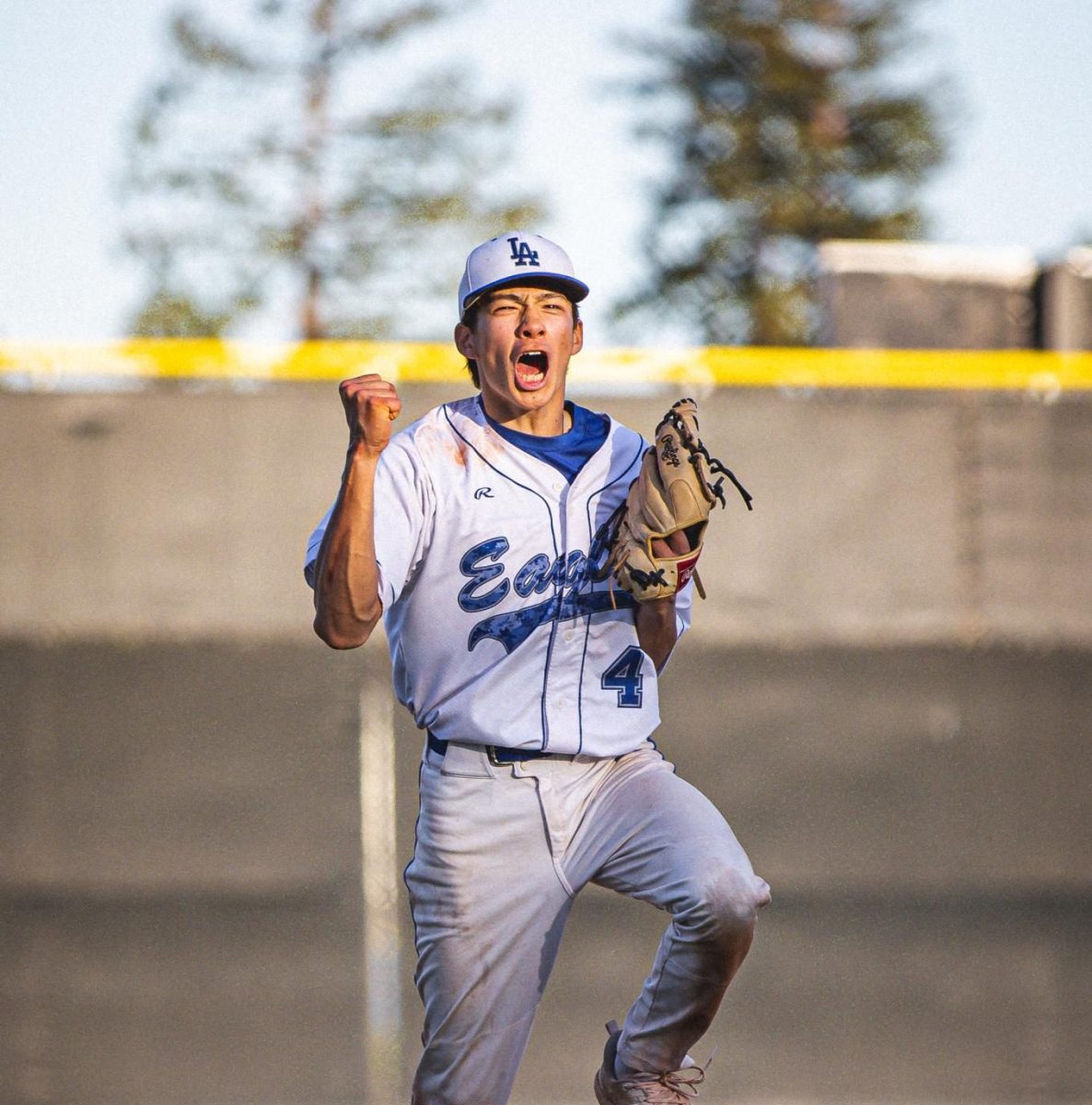 Senior Kai MacQuiddy celebrates his first league win on the varsity boys baseball team. Kai recently announced his commitment to continue his baseball journey at Amherst University.