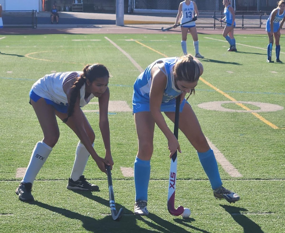 Senior Kaveri Desai battles for the ball with a Branham player.