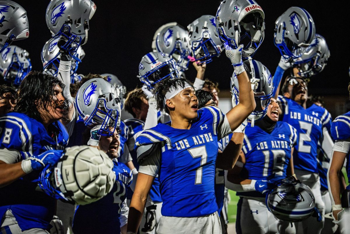 The Los Altos High School football team celebrates after their homecoming victory over Santa Clara High School.