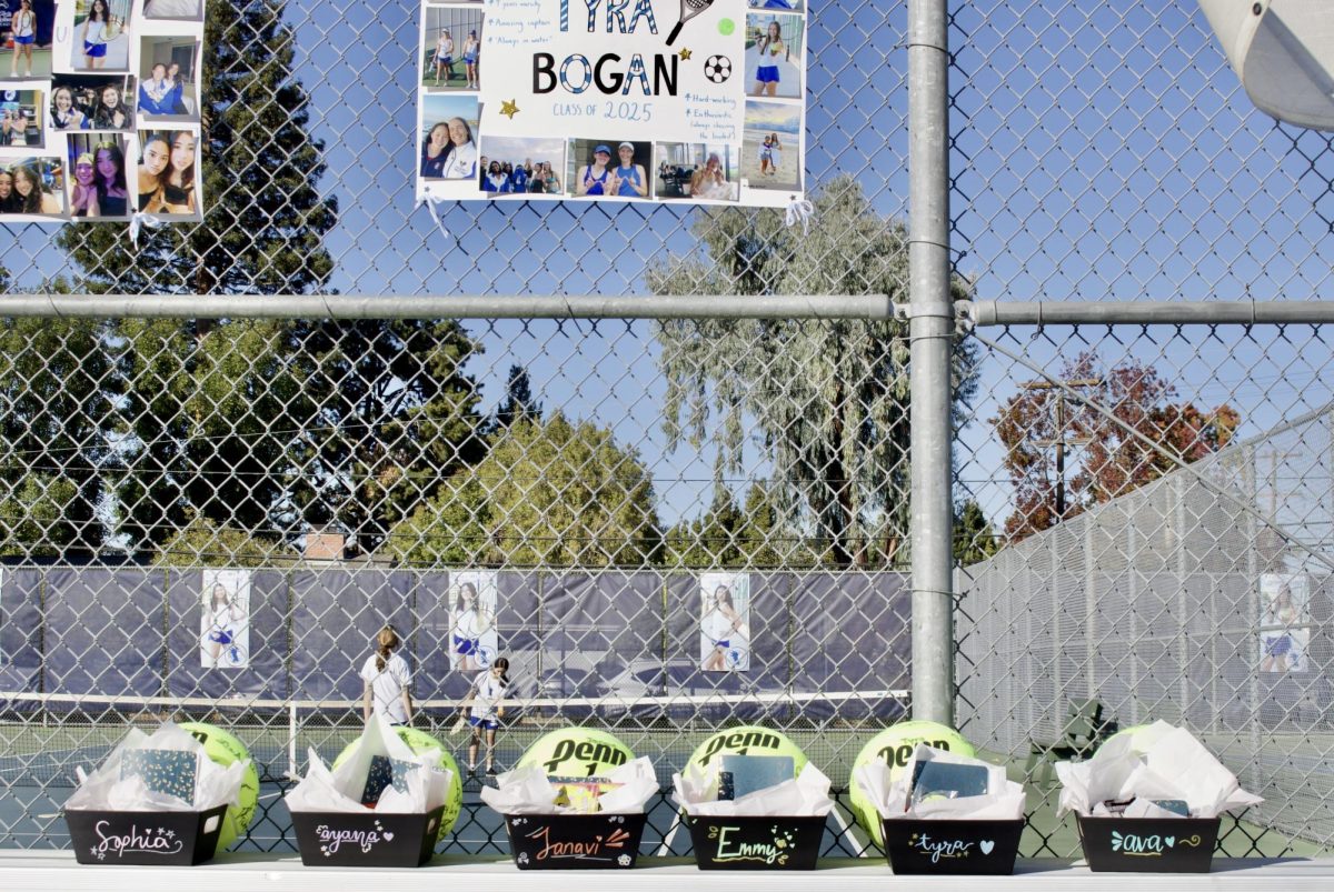 The varsity girls tennis team underclassmen prepared posters and gift baskets with a tennis ball signed by the team for the seniors.