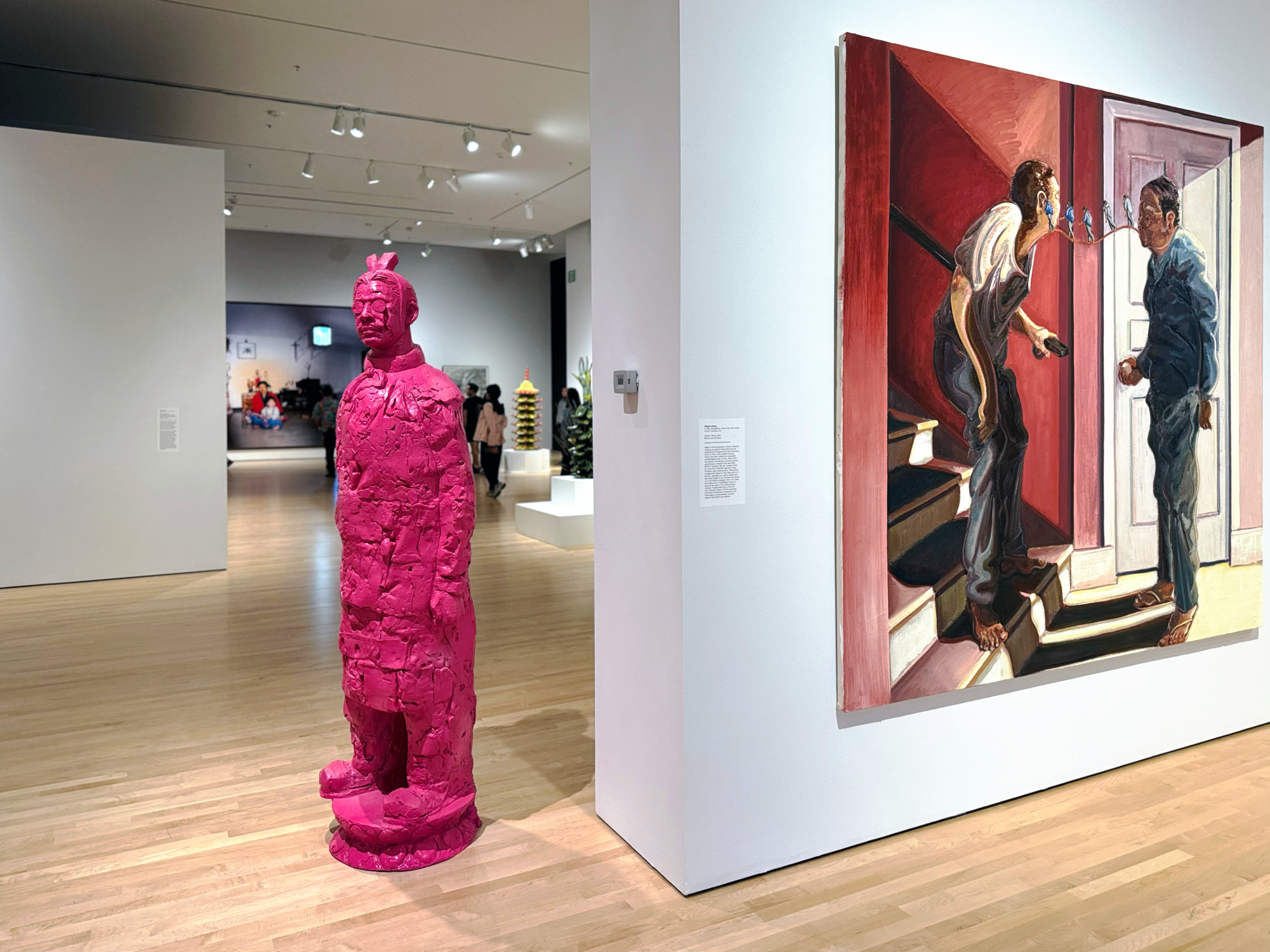 A pink statue and Timothy Lai's "The Accusation" (right) are displayed within "Spirit House"