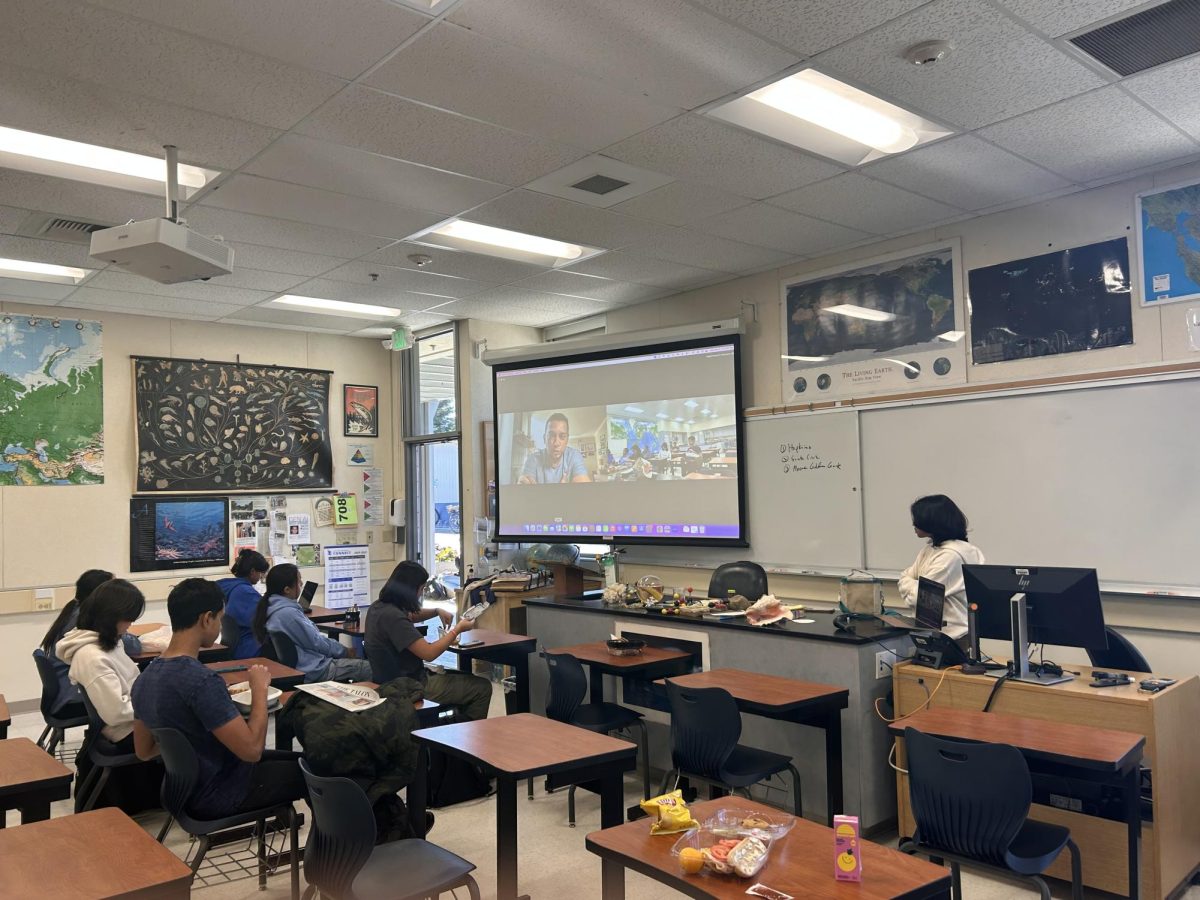 Apple Product Executive Andy Narayanan answers questions from students during a Generative AI club meeting. He describes his experience working with generative AI as well as its impact across leading tech industries.
