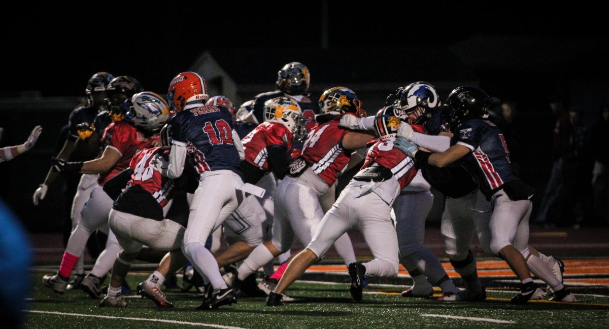  Juan Lopez Gonzalez (Eagle helmet) tackles on a South offensive drive from their own five-yard line to try to get the ball back for the North. 
