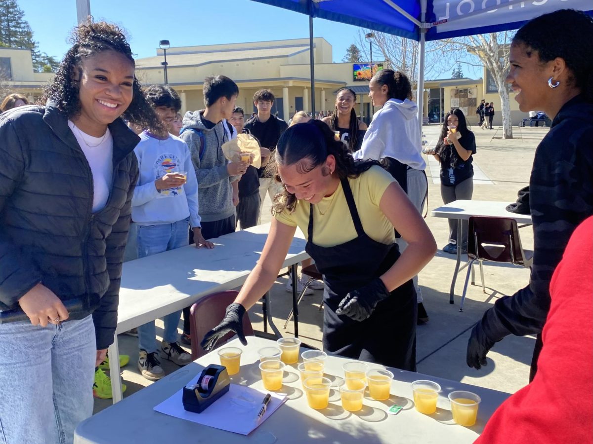 BSU members helping prepare lemonade to hand out during their food fair.