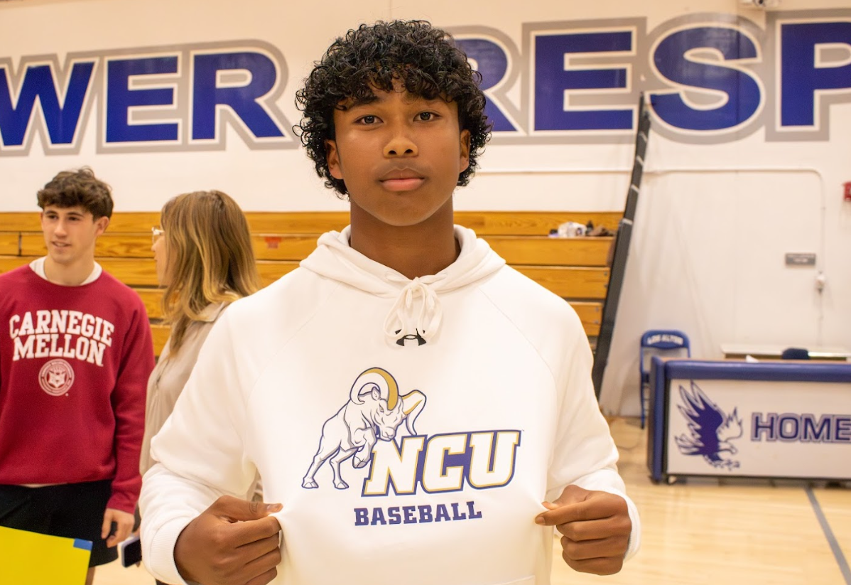 Senior Darrion Wesley shows off his North Central University Baseball commitment hoodie at the college athletics signing event on April 16. 