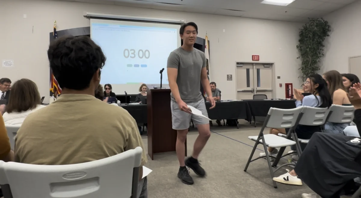 Junior Aaron Zhu returns to his seat after giving his speech about preserving AP Human Geography at the MVLA Board Meeting. In a previous board meeting, the board mentioned the removal of AP Human Geography and AP European History, resulting in students and teachers speaking out against this during this meeting.