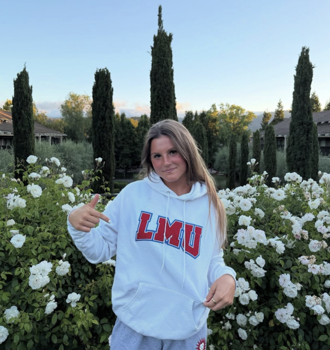 Senior Sophia Boschken poses in a Loyola Marymount University sweatshirt. The water polo player verbally announced her commitment to the Division I school in July of this year.  