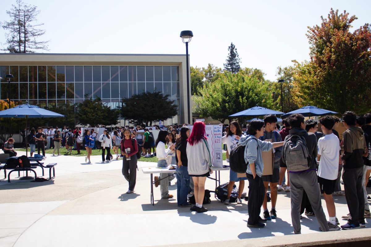 Students gather in the main quad for Club Day, where members of 32 clubs presented posters and encouraged sign-ups.