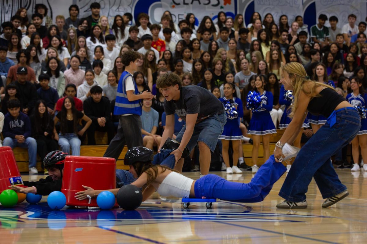  Cheerleaders hype up the students during the annual ASB Back-to-School Rally; the majority of sophomores are still not wearing their class shirts and colors.