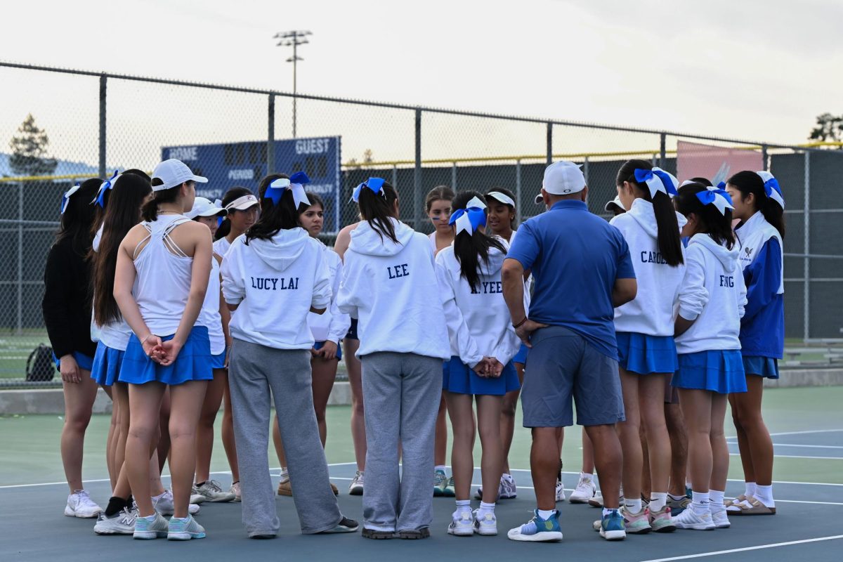 The Eagles gather for a huddle before the match begins to prepare for the difficulty of CCS face-offs. This year they hope to defend their title and come out on top as CCS champions once again.