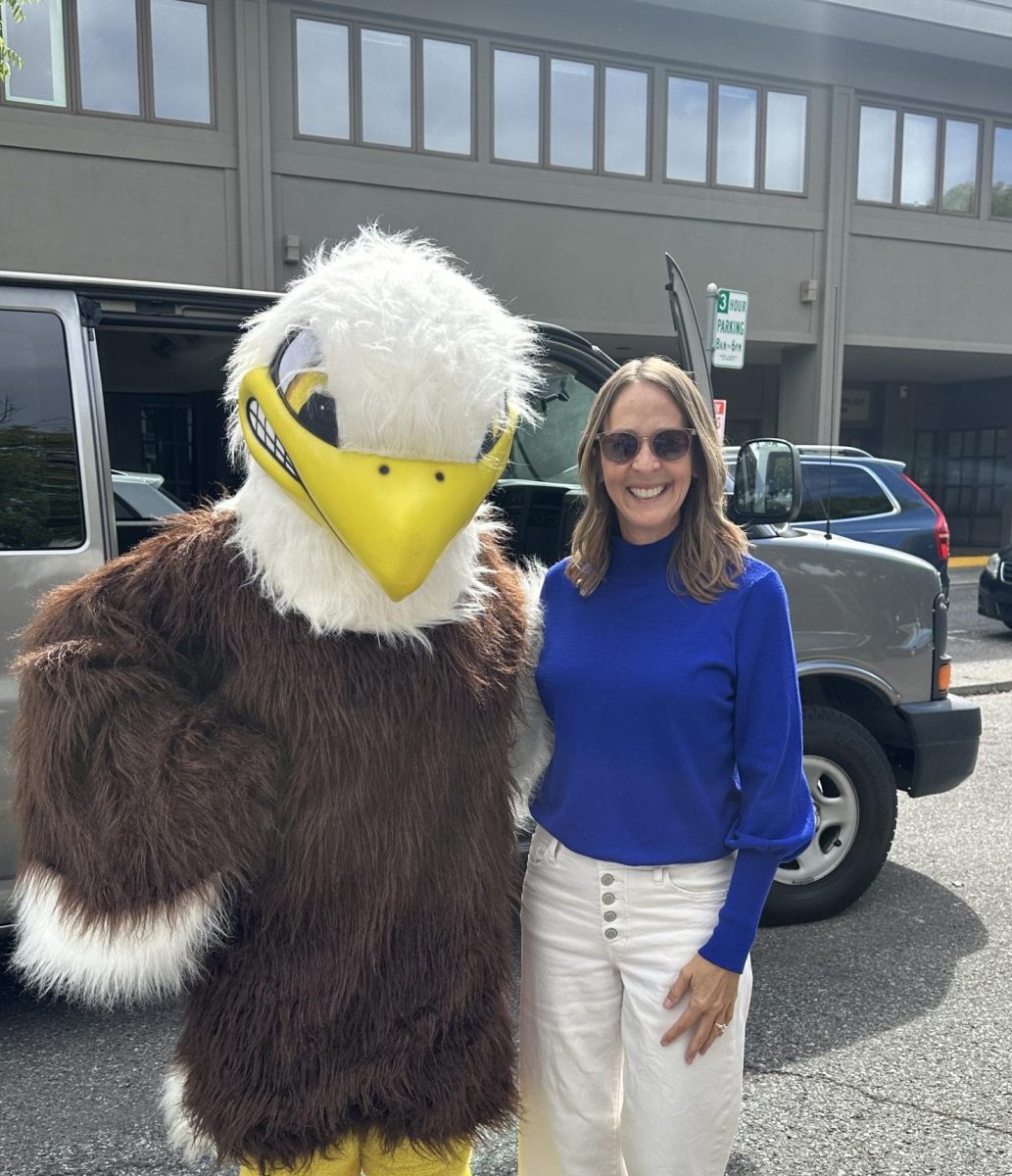 Shandell Randall poses with the Eagle, LAHS’ school mascot, a symbol of school pride and unity.  
