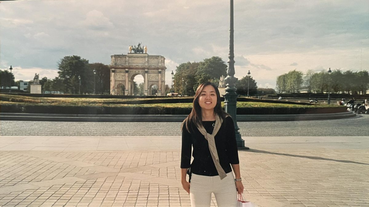Chai stands in front of the Arc de Triomphe on a business trip to Paris. From an arts high school in South Korea to designing for Alfani Intimates in New York, Chai’s fashion journey has taken her to many different places across the globe.