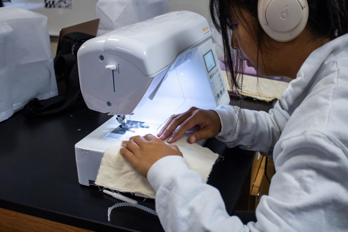 Senior Zellia Kwok sews a handmade tote bag. Zellia is among 85 students studying the world of fashion in LAHS’s new course, Fashion Design I.