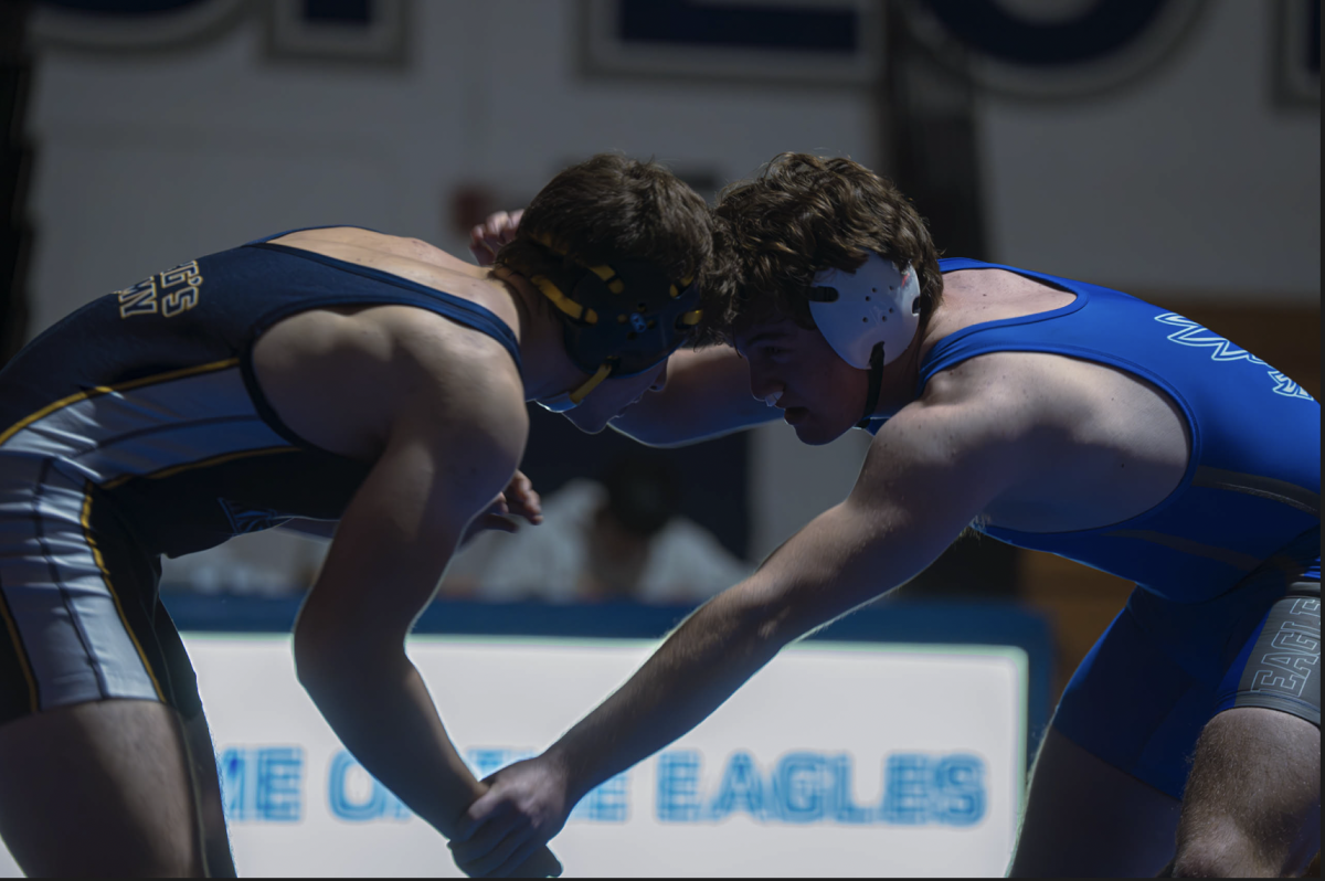 Junior Caleb Bren faces a Kings Academy wrestler at a home duel meet. Caleb fought hard up until the fourth quarter, but ultimately lost on a minor decision.