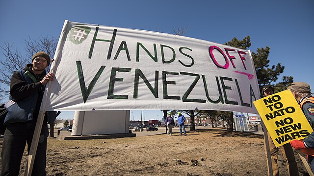 Protestors in favor of Venezuelan President Nicholas Maduro advocate against United States military intervention.
