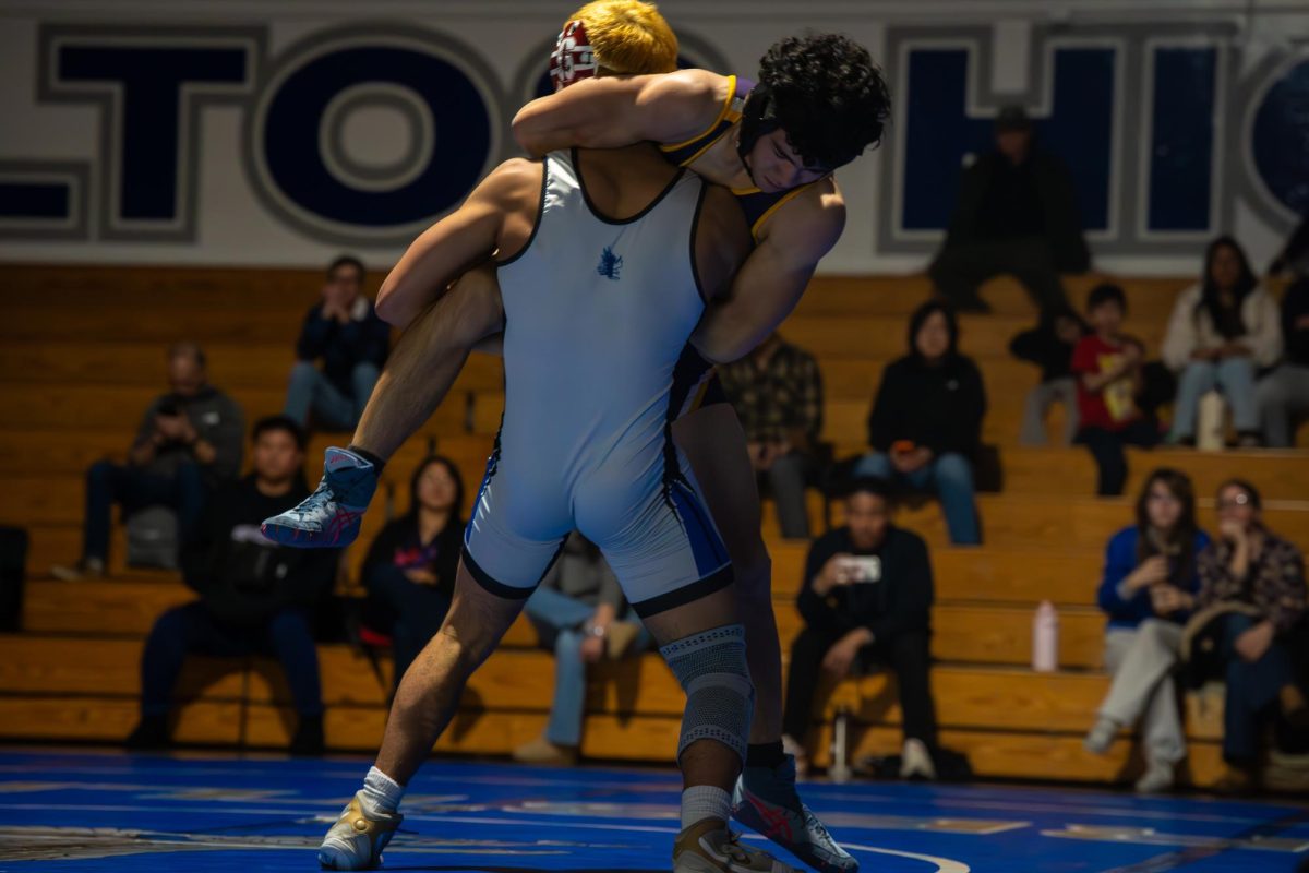 Freshman Leonidas Marinopoulos picks up Monta Vista wrestler at the Eagles' senior night duel. Leonidas quickly pinned his opponent in the second period. 