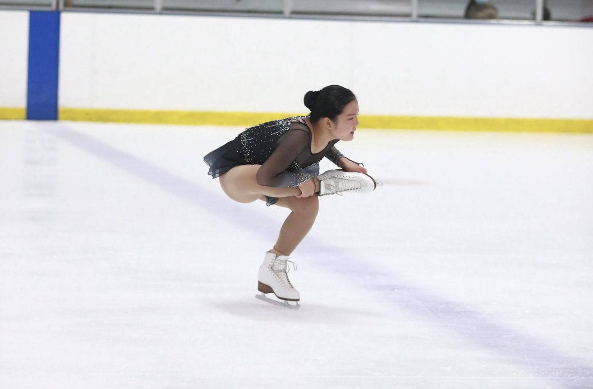 I’m captured mid-spin during a competition in San Francisco. This photo, taken in 2021, is one of the few I have left from years on the ice.
