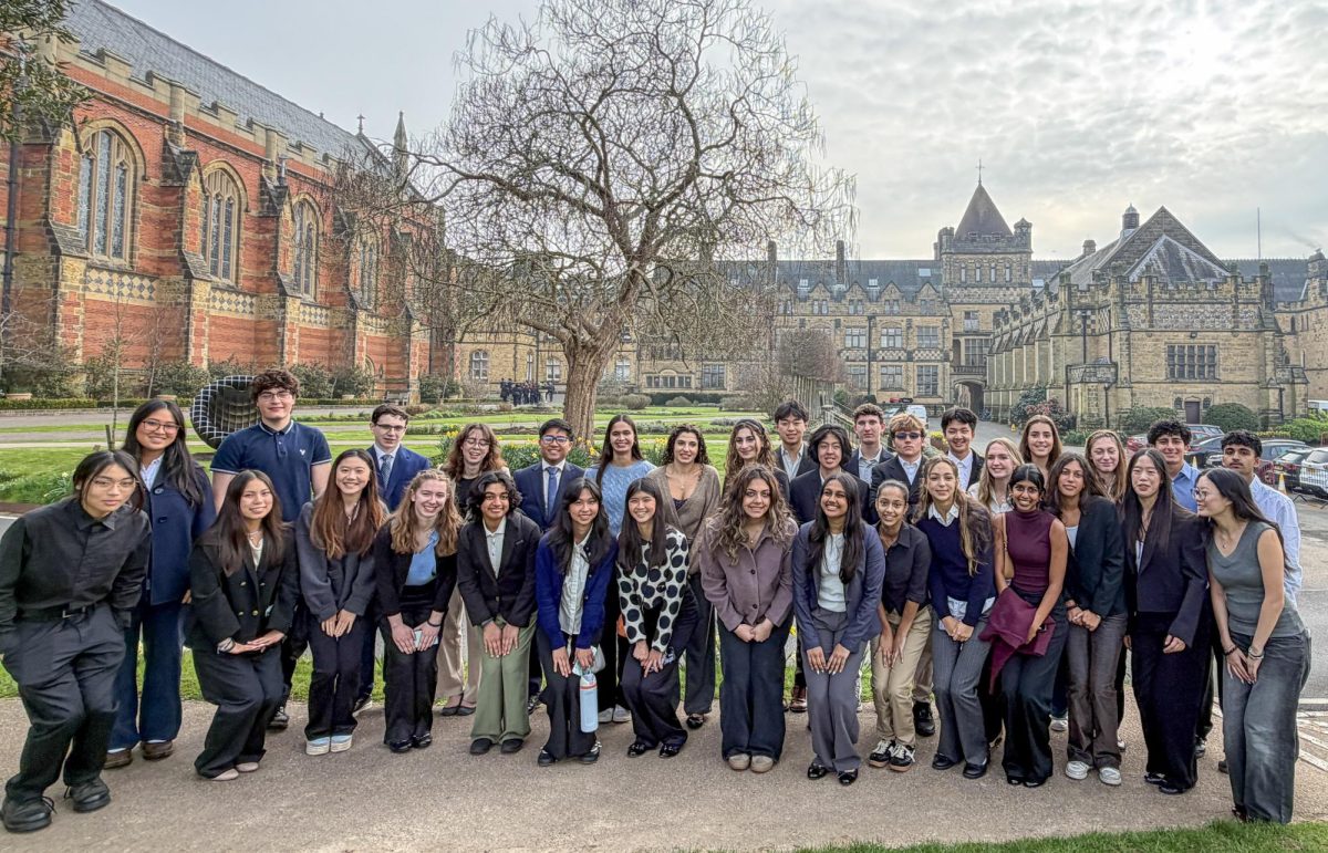 The Advanced Science Investigation (ASI) class pose for a picture outside Tonbridge School. The class traveled to London to present their research projects at a science symposium in March.