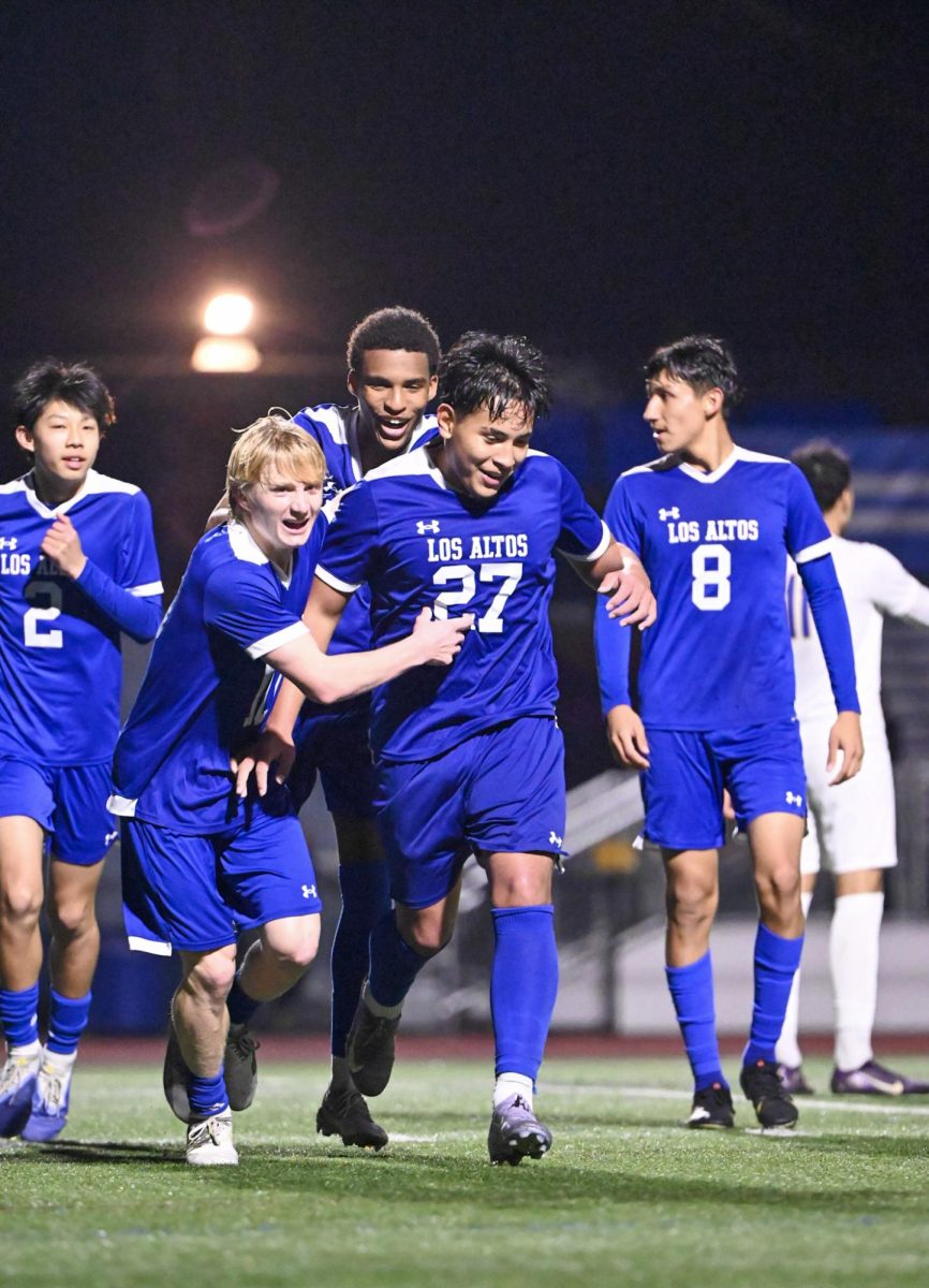 The varsity boys soccer team celebrates after scoring a goal during their senior night game against Santa Clara where they came out with a 2-1 win against the Bruins. For the first time in over two decades, the team closed out their season with a De Anza League championship. 