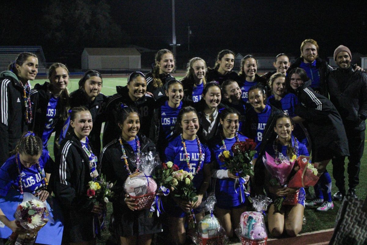Girls soccer poses as a team to celebrate the seven graduating seniors on senior night on February 12. The team took a 3-1 victory over Notre Dame to celebrate the occasion. 