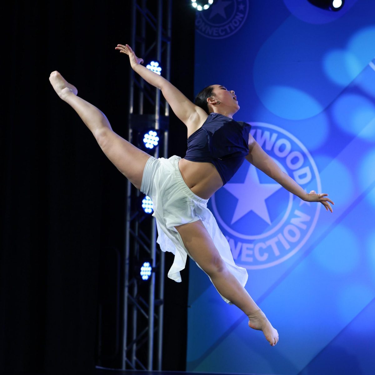 Noel performs a lyrical solo at a competition. She is recognized for her performances at LAHS rallies, where she transforms the gym floor into a dance floor.