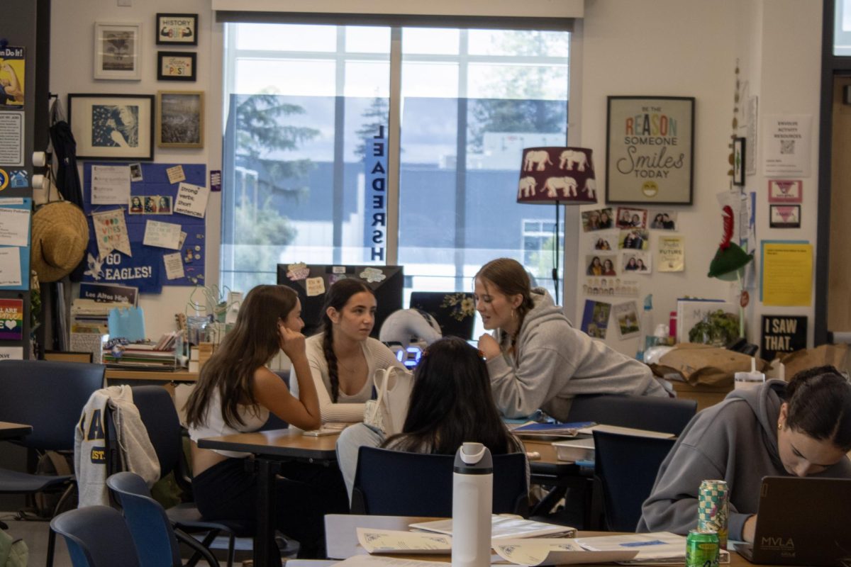 Juniors Chloe Yu, Eliana Belikov and  Maddie Newman chat in SCL class. Only incoming SCL officers were guaranteed admission into next year’s class. 